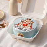 Small round cake with 'Super Dad' text and cartoon character in a takeout container.