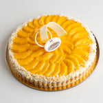 Mango tart with a decorative top on a white background