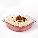 Dessert dish with white cream and strawberries on a white background