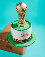 Cake with a World Cup trophy design on a turquoise background