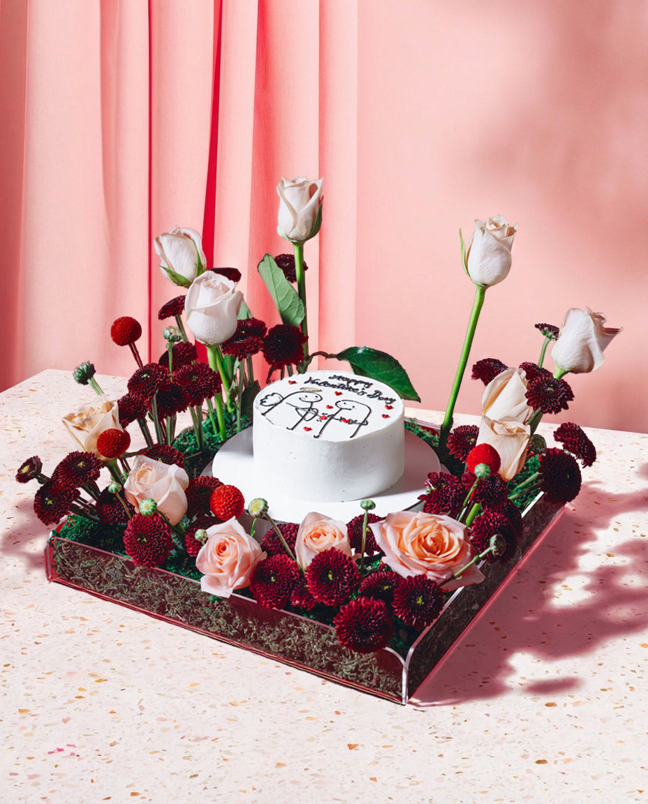 Decorative cake with flowers on a pink background