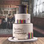 Graduation-themed cake with candles and a cap on a blurred background of people celebrating.