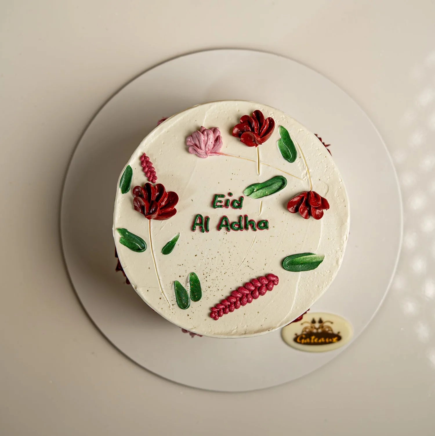 Eid Al Adha cake with floral decorations on a white plate