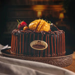 Chocolate cake with fruit toppings on a dark background