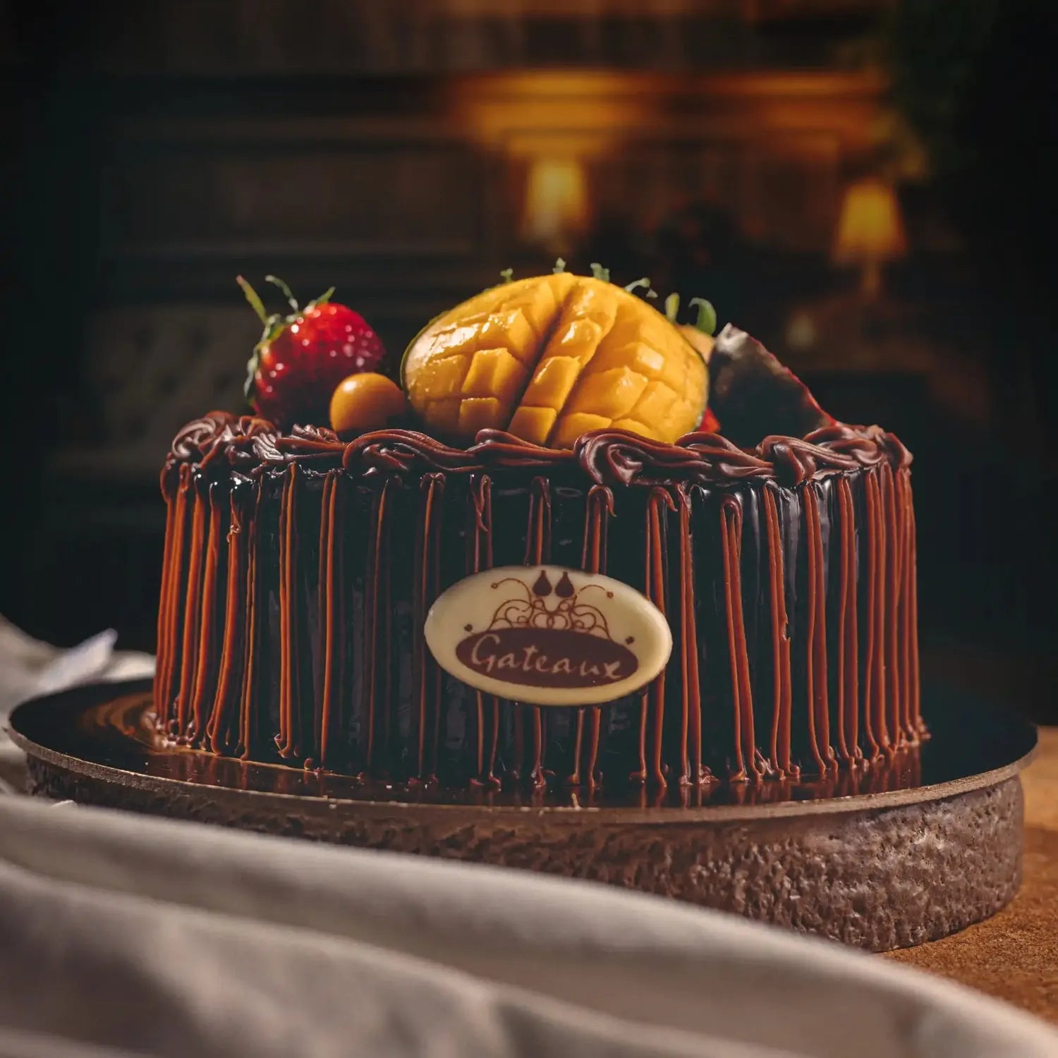 Chocolate cake with fruit toppings on a dark background