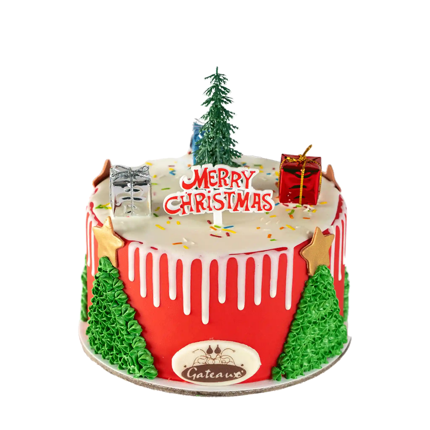 Christmas-themed cake with red icing, green trees, and 'Merry Christmas' decoration on a white background.