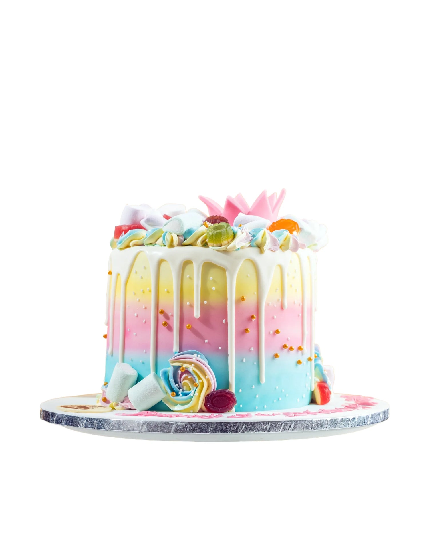 Colorful cake with rainbow frosting and decorative elements on a white background