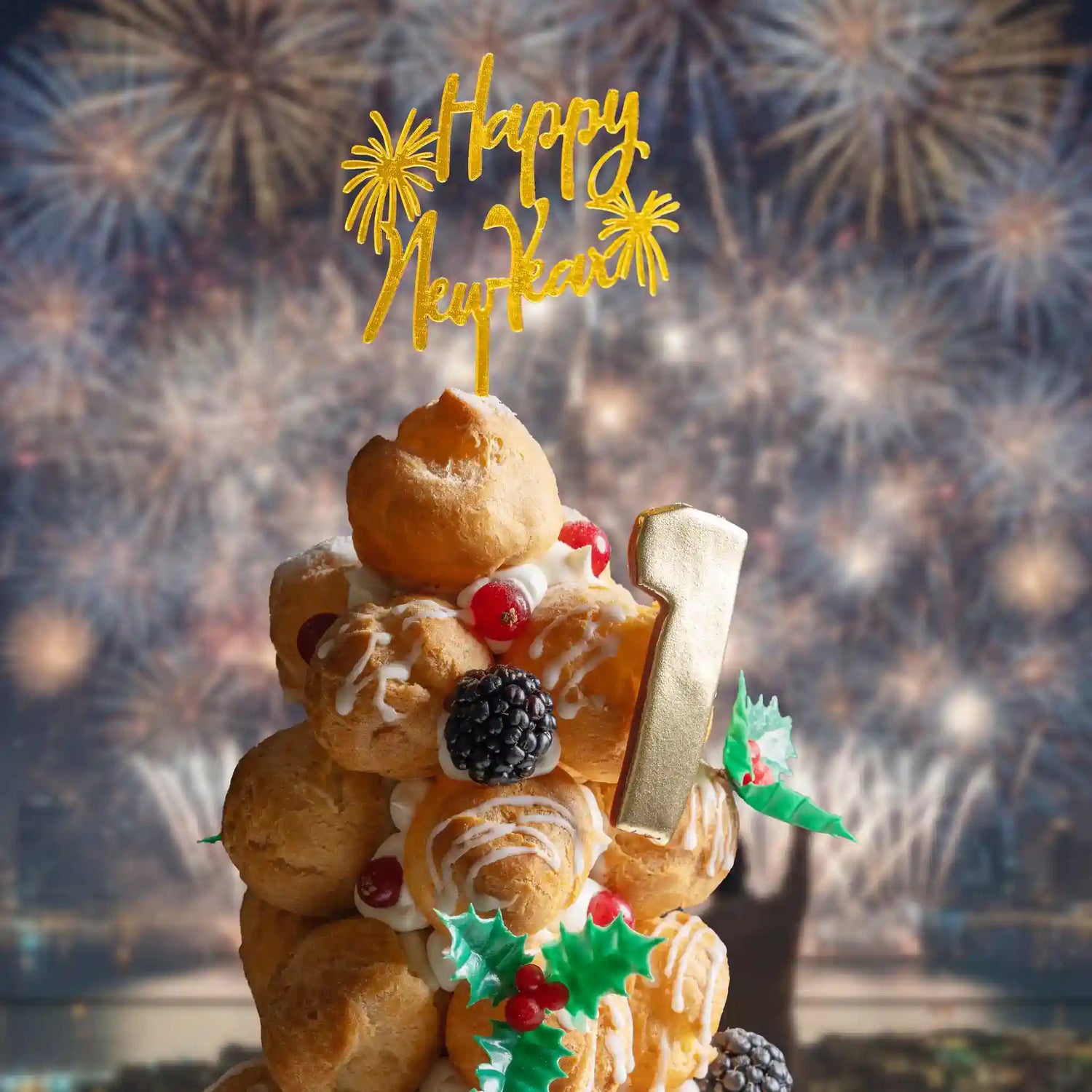 New Year's Eve cake with 'Happy New Year' topper and fireworks in the background