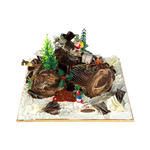 Decorative cake resembling a log with Christmas-themed elements on a white background