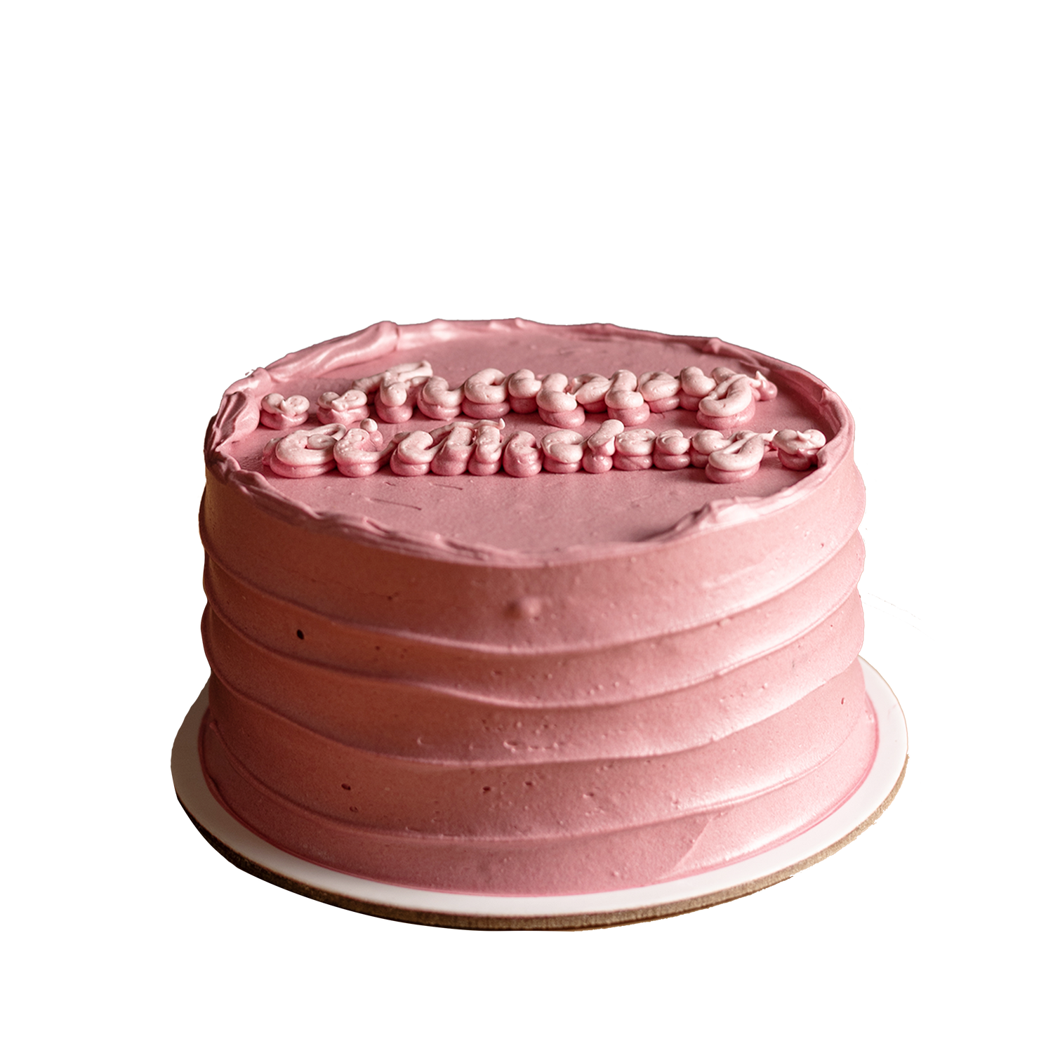 A small, round, pink birthday cake with decorative frosting and sprinkles on top.