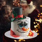 Snowman-themed cake with a blurred festive background