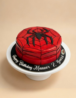 Spider-Man themed birthday cake on a beige background