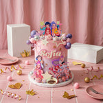 A custom-decorated pink birthday cake with cartoon princess character toppers and the name 'Sofia' on the front, styled on a pink tiled table with party decorations.