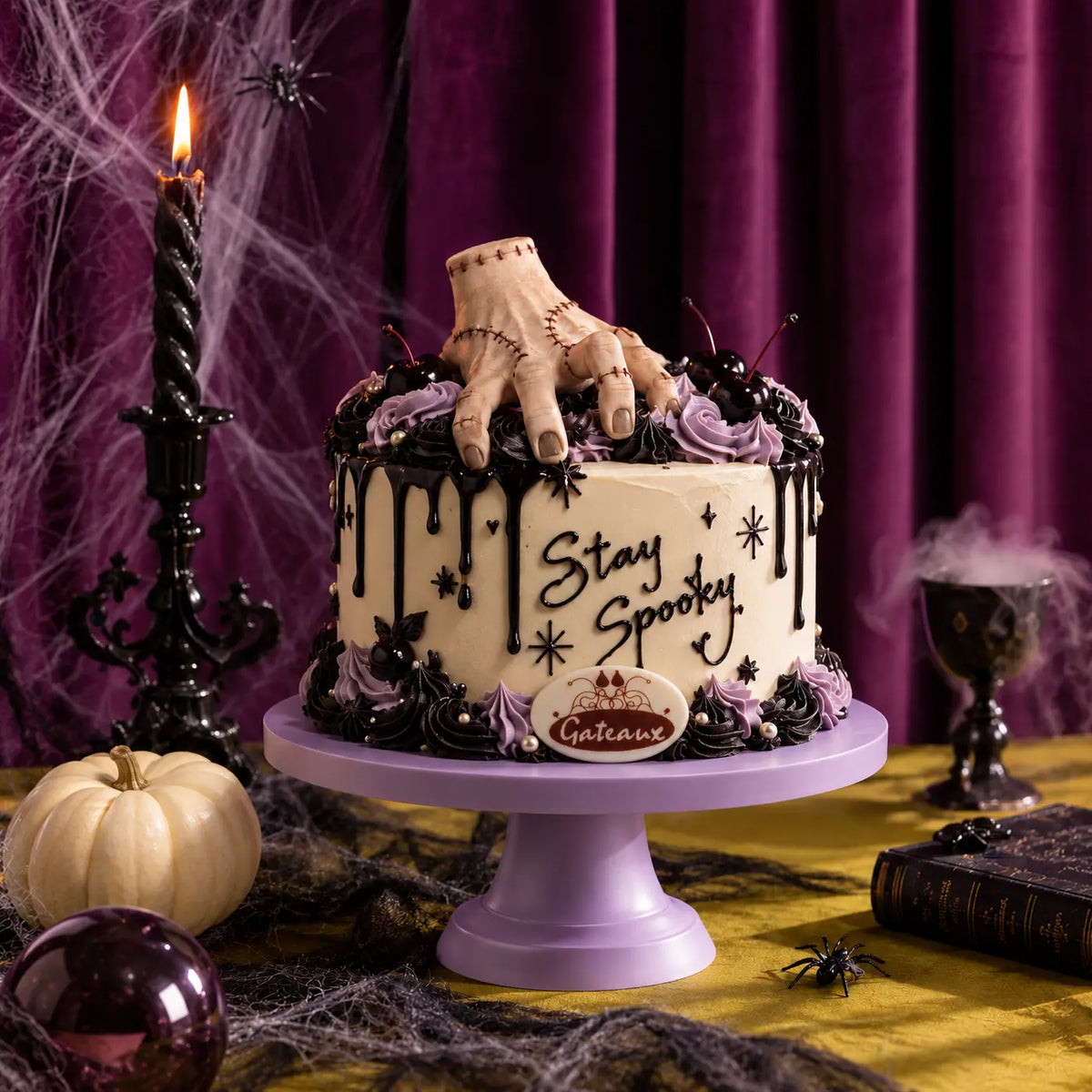 Creeping Charm stitched hand design featured in our Halloween cakes selection
